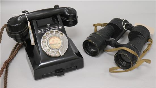 A vintage black Bakelite telephone and pair of Ross WWII Bino Prism No. 5 Mk 3x7 binoculars,